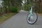 Green bike on wooded trail