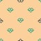 Green and black Pretzel icon isolated seamless pattern on beige background. German comfort food pastry. Oktoberfest