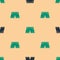 Green and black Swimming trunks icon isolated seamless pattern on beige background. Vector Illustration