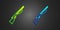 Green and blue Hunting gun icon isolated on black background. Hunting shotgun. Vector