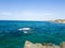 Green and blue sea with rocks