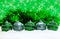 Green and blue and silver Christmas balls in snow with tinsel and snowflakes, christmas background