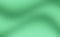 Green blurred gradient background with warm shades.