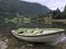 Green boat drawn up on the shore