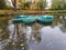 Green boats and pond in park