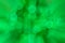 Green bokeh of Christmas light with zoomed in effect