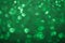 Green bokeh lights background. Unfocused abstract red glitter holiday background. Christmas, Valentines day, St. Patricks Day cele