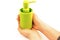 Green bottle packing of sanitizer, antiseptic with dispenser for sanitary soap, gel and detergent in female hands. Isolated on