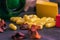 Green bottle of supplements with yellow capsules on a black background