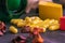 Green bottle of supplements with yellow capsules on a black background