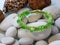 Green bracelet and sea shells