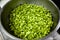 Green Broad Beans, Vicia Faba in Silver Pot â€“ Fresh Shelled Fava in Kitchen Bowl, Big Bunch