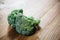 Green broccoli on wood table