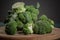 Green broccoli on wood table Broccoli. Fresh green broccoli on table. Top view. Free copy space