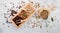 Green and brown decaf unroasted and dark roasted coffee beans in wooden box with scoops setup on white concrete background