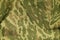 Green and brown military camouflage uniform pattern.