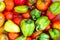 Green bulgarian pepper and tomatoes background