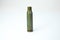 Green bullet from Kalashnikov automatic rifle at white background