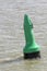 Green buoy as a marker for shipping