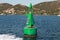 Green buoy with solar battery, canal border mark