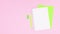 Green business or school stationery appear on pink theme. Stop motion