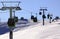 Green cable cars in Transalpina ski resort, Romania, in winter