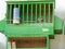 Green Cages For Domestic Birds With Pigeons Inside