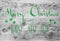 Green Calligraphy Merry Christmas And Happy New Year, Wooden Background