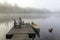 Green Canoe and Dock on a Misty Morning