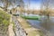 Green canoe parked in the shore of a river