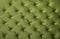 Green capitone tufted fabric upholstery texture