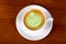 Green cappuccino with cream