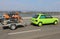 Green Car with Orange Dirt Bike on Theodor Heuss Bridge