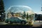 A green car parked in front of a giant bubble