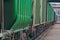 Green cargo wagons close up