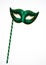 Green carnival theatrical mask with gold ornament with handle