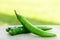 Green cayenne pepper on wood table