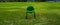 green chair in regulation soccer field with door on the bottom. football and business. bench, sitting in the field