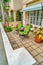 Green chairs at front patio of home with scenic view of Long Beach neighborhood