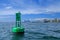 Green channel marker and cruise ship