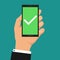 Green checkmark on smartphone screen. Hand holding smartphone. Mobile phone with white tick. Success concept. Modern design for we