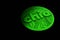 Green chia coin isolated on black background. Chia eco crypto currency, 3D rendering
