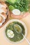 Green chicken soup with egg