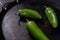 Green chili peppers on a traditional Mexican comal