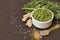 Green chili thecha or chutney with ingredients served in a bowl