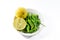 Green chili and yellow lime lamon on the white background