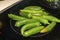 Green chilies on hot plate