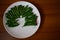 Green chillies arranged in beautiful pattern on a plate