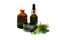 Green chlorophyll in cup, pills and concentrated solution in bottles