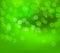 Green christmas blurry background. Winter green bokeh vector card wallpaper illustration. New year green lights poster